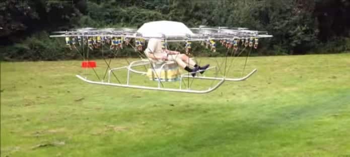 Man builds an awesome helicopter from 54 drones and garden chair