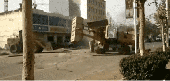 Six Bulldozers Battle Each Other on the Streets of China in the Craziest Fight Ever