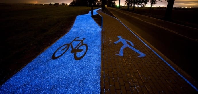 This solar-powered bike path glows bright blue at night