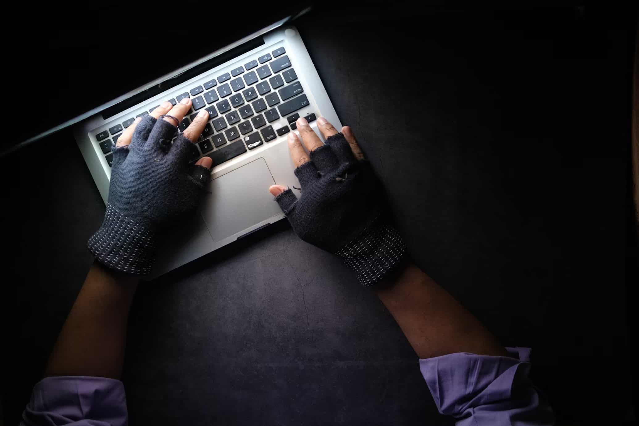 a threat actor using a laptop